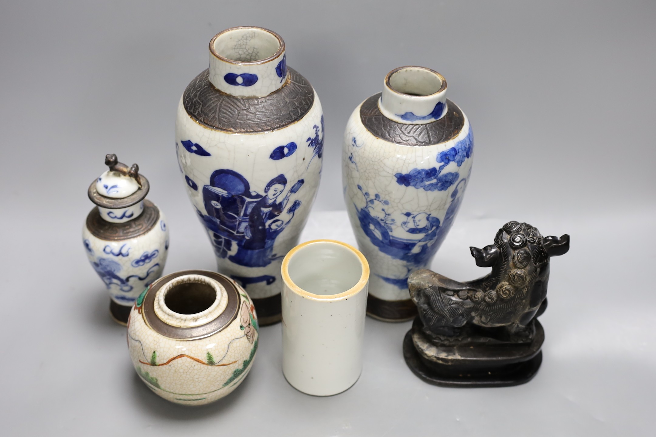 Three Chinese blue and white crackle glaze vases, a famille rose brush pot, late 19th/early 20th century, a crackle glaze ginger jar and a carved soapstone lion-dog (6)